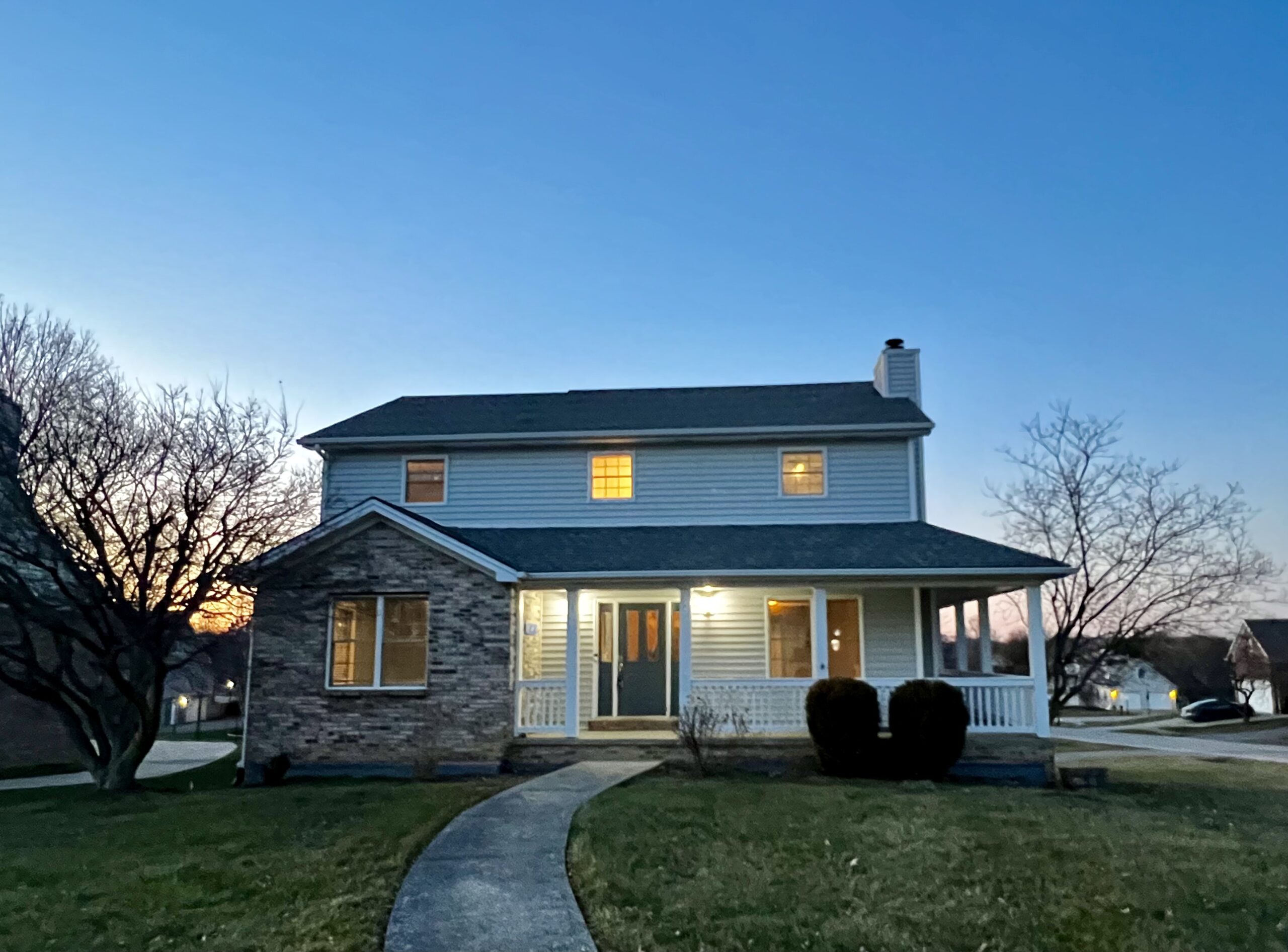 Real estate listing twilight photo with warm glow.